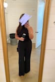 Absolutely loved this jumpsuit! It was of course long which is what I expected. I hemmed up about an inch on my own and it was fine. I was comfortable throughout the wedding and plan on wearing it again for other events. My only complaint is the zipper did not go all the way down. I thought it was caught on the fabric, but the zipper was sewn up. Body-wise - bra size is about 36DD/DDD. I have huge love handles. I do suggest boob tape of course and also double side tape for the sides. I hope this helps someone! - Alexandria M.