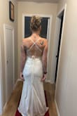 I Ordered three potential wedding dresses and decided to keep this one as a strong possibility. It's fancy enough but also simple enough for my beach wedding. Fabric, detailing and length are all absolutely perfect.
My only criticism is that the dress is a bit heavy to be held up by spaghetti straps- I have a feeling they'll dig into my shoulders as the day progresses. If I go with this dress I might alter it such that it is essentially a strapless dress with straps if that makes sense...

Beautiful dress all in all and it might be the one I end up wearing :) - Leah K.