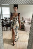 The dress is absolutely perfect, it is exactly like on the website. My size is normally S but I decided to buy XS and it fits perfectly! - Rayra M.