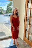 This dress is a beautiful color and extremely flattering. I originally ordered a medium but the small fit better. - Carol G.