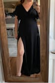The small was almost too short for my height (5'2) once I put high heels on. I like the slit and the way it ties in the back. I also loved the neckline and sleeves. I usually wear a small or medium. However, I tried both sizes and they were too tight in the bodice. - Shirley