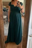 Tried on many dresses and picked this one. Beautiful color and love the sweetheart neckline. I like the look of the sleeves up versus down. I will put a piece of tape to make sure they stay up! Cons, the length is super long (on both the small and medium - I'm 5'2) so had to get it hemmed. The top also has a rubber strip to keep it in place, but it flips up and you can see it. Not super noticeable tho. - Shirley