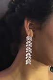 I purchased these to compliment a homecoming dress and they were absolutely perfect! Just the right amount of dangle, shine, and glam to bring it all together! They are a little heavy. - Shandy B.