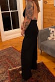 I ordered this to bartend a wedding. Wanted something professional, yet still sexy. This fit the bill. I'm typically a large in all things Lulus, but I have an extremely long torso so I ordered the XL to accommodate for extra torso length. It was the perfect length in the body, the straps pretty much stayed put through making drinks, and it was thick enough that just some KT tape for a makeshift bra was sufficient. As suspected the legs were very long, so I wore 4-inch heels but will need to hem it a touch for future wear. I got tons of compliments and felt great. 10/10. - Marit J.