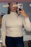 This sweater was see-through. It runs a little small for me. The worst part about this sweater was the stitching around the neck. It looks like there is a double neck line from the turtleneck and then this weird stitch that makes you look like you have a bib on. - Nicole I.