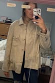 This jacket was actually really really cute, it was just way too big. I should have listened to the other comments and ordered a size down. - Nicole I.