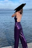 I wore this jumpsuit for my schools homecoming and it was so cute and comfortable. I would be aware that it is a little loose but not enough that you would want to change sizes. Great material overall amazing jumpsuit. - Kelli I.