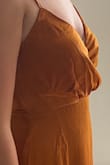 Love the rust color, it is gorgeous on, but the top is incredibly unflattering. Even if I had a larger chest the way that the top is pleated and attached to the skirt adds an odd buldge below the chest. I will try to take it to a tailor but I'm not sure how they would fix it due to the poor construction, which is unfortunate, because I do love the dress. - Nicole P.