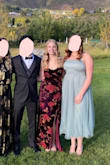 Wore the dress to a black tie wedding and it fit perfect. I'm typically between a S/M so I went with a Small on this and it was great, even had room. It looked flattering tighter, but was comfy to sit in and dance in. As far as strapless dresses go, it stayed up 90% of the time which is honesty the best you can ask for. I really liked it - Emily B.