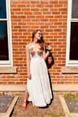 I bought this dress for my bridal shower, and I loved it! My only complaint is that when I hung it on a hanger, the top clasps in the front began to stretch (the string holding it to the dress itself), thus opening the dress a bit more than intended (you can see it a bit in the first picture). So buyer beware of that. But otherwise, it was a lovely dress. - Alaina B.