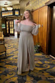 The material was smooth, the fit was super flattering, and the sleeves can be worn comfortably off the shoulder and on. I would recommend wearing heels or platforms because it is very long. - Alta T.