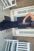 I'm obsessed with this dress! The color is a bit lighter than navy in my opinion, and is a perfect deep blue that makes the dress versatile for many occasions. It has a flattering line and band at the waist. I love the way the bottom flows and moves with you as you walk. The sequins are not heavy and add such a glamorous touch. It fits true to size but is very long; I had to have 3 inches taken off the bottom. - Michelle S.