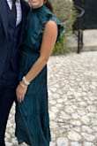 I absolutely loved this dress for a cocktail attire wedding. Fits true to size but does have a good amount of stretch if needed. I'm usually between a small and a medium but went with the small and it was perfect. A tad bit scratchy around the neck but nothing terrible. - Katie C.