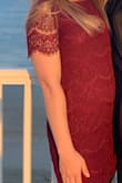 Loved the dress and it looked great in photos. However, it was a bit shorter than expected and it was constantly riding up. I had to keep pulling it down so it wouldn't show anything, especially while dancing. - Macy H.