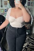 It's stretchy enough to fit perfectly! I could have gotten away with a large as well if I knew how stretchy it was but it fits great! - Gigi P.