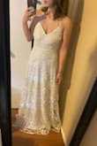 The sequins make it look super cheap, which it was cheap, so it's on par with what I would expect. It looks way better in pictures than in person.  It has a nice weight to it and the back is pretty, but the front isn't flattering on me. I'm 5'4 and would definitely need to get it hemmed (wearing 4in heels in the picture) Probably will not use this as the dress for my wedding, as I don't like the overall look or feel. - Amanda C.