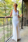 This dress was amazing straight out of the box, no fitting needed. I had it hemmed. It has just enough sparkle to make a statement yet very classy. It was easy to sit in without any pulling or tugging. All around an amazing find! - Diane I.