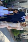 This is a very beautiful dress, but very heavy lace, and the amount of ruffles and layers at the bottom made it heavy! Very elegant and perfect for the wedding! I'm 5'3 125 lbs and small was perfect! Little tight in the bust, being a 34C - Patricia R.