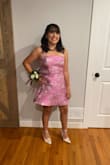 Before you order the dress I would go up a size. I ordered a small, going off the size chart and it wouldn't zip up all the way. I then got it altered and it finally slipped right on. Other than that, the dress was beautiful and was my dream dress for HOCO! I felt supported in the bust and it was easy to move around in. Also, I would recommend steaming it before wearing it due to the wrinkles from being shipped. - Sadie J.