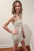 This dress is absolutely beautiful and it fit like a glove. When the lights reflect off of it...WOW!! Simply stunning!! I got many compliments on this dress. Keep in mind, the taller you are, the shorter it's going to get. - Michelle T.