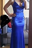 This royal blue colour was EXACTLY what I was looking for. The style is beautiful. And the dress fit perfectly to my body. I had to get it hemmed because it was too long but that's no problem. My only complaint is the fabric gets VERY caught easily on uneven nails or cuticles and it pulls out the little threads in the fabric. :( - Janice K.