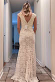 The dress felt comfortable, and of good quality. Unfortunately, I really wanted long sleeves since I'm having a Thanksgiving wedding so I went with another dress. The other dress didn't make my hip dips as prominent, and overall was a better fit (aesthetically) for me. It did need some adjustments, but so does every wedding dress. It definitely needed hemmed & the shoulders taken in. The waist also needed taken in so I didn't lose my figure in the fabric. This dress would be perfect for a spring or early fall wedding. It would look great with a slip under to give it more fullness at the bottom. The sleeves are actually just straps with lace added, a super cute touch. This would look especially good for a rustic wedding! Super cute just not what I was hoping for. - Matty A.