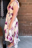 The colors of this dress are gorgeous and I was so happy with it looks in person. This dress definitely shows a lot of cleavage. I probably should have sized up to the large, but I think I would have been swimming in it up top. I used a safety pin to try not to fall out of the dress, but I love the dress enough I'll probably get it tailored to fit me properly. It's a very fun dress and I got lots of compliments. - Rachel L.