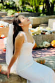 The dress size fit me perfectly but it was a little bit too long. I brought it to the seamstress. She helped me trim a little bit in the front of the dress and kept the tale. It looked so classy. The materials of the dress are really good quality for the price. I love my wedding dress. - Prem L.