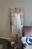 Dress is fine if you don't plan on dancing or moving much. Bust and little sleeves were tight but otherwise fit well - Sara L.