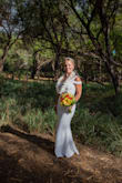 I loved wearing this gown for my 10-year vow renewal. The dress was absolutely perfect in every way possible. - Denise D.