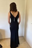 I loved this dress! It fits great and looks very elegant. The length just hit the floor with 2.5 inches hells (I'm 5'7"). The material is stretchy and a little warm. - Tammy S.