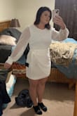 I grabbed a Large which I usually wear. I'm not an XL in any other brand so I didn't think to possibly size up. I'm a size 10-12 in pants and a size medium top. This dress was roomy in the arms which I wasn't expecting and hugged the right spots. Very flattering but is a bit short. I cannot bend over in it. Which is not what I was expecting since I'm not tall I usually have a problem with things being too long but not this dress! I love that it's not sheer and I could wear any color under garments with no problem! - Torey G.