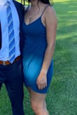 This dress is truly beautiful. I wore it to 2 different weddings and got compliments from several people saying how nice it was and how flattering it looked. I did not need to wear a bra (which was a plus for me). The fabric is quite stretchy and soft, which makes it comfortable but easy for it to move around. The dress would slide up on my legs just from walking. I had to watch myself on the dance floor for this same reason and it would also slide down on my chest. I may try fashion tape the next time I wear it to see if it keeps the dress in place. - Gabriela P.