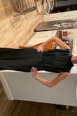 The dress is a beautiful, slim fitting. needed to be altered a little to fit, bigger in the chest than expected. - Sarah E.