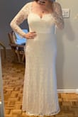 The dress was much nicer that I originally thought it was going to be. The one thing I felt was that the lace on the arms just looked like cheap lace, but for the price of the dress I couldn't be that annoyed. The lace on the shoulders did keep standing up, but I think if I had ironed it that would have been fixed. 
I am tall and was impressed that it was long enough. 
I ended up returning it because I wanted something less traditional but with a belt to break up the front it would have been super pretty. - Madison C.