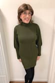 Very warm and comfy dress. I also like the olive color. It runs a little large, like most sweater dresses, in my experience, so I sized down one size, and it fits fairly well. It's not terribly sexy; the placement of the cable stitching creates a paneling effect, and it has a bit of a bulky look, though that's really not too bad; I remedied that somewhat by sizing down. I do like that the lower half of the sleeves are tight, making them nice and comfy, and they keep in the warmth. It's a good everyday dress to wear when it's cold. And though, as I say, it's not super sexy, it is attractive, and you will feel secure both in the way it looks and how warm you will be. If you like feeling toasty and snug, this dress is for you! - Jo N.