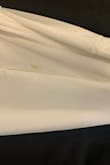 I tried this one a Large and was too big.  I ordered the Med and it fits perfectly & but there is a stain on the back right by the butt.  I'm getting married in a week.  So disappointing, but beautiful dress.  I would say it does run large if you are small in the chest area - Bekkah B.