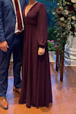 This dress was wonderful for an outside wedding on a cold fall evening. It was a very last minute purchase due to the weather changing within a few days of the event and I am so glad I have it. The v-cut was too low for my taste but a simple safety pin solved that. I am 5'7 and it touched the floor with 3.5 in heels, which is what I wanted, though I will likely hem in the future to wear with shorter heels. I may have been able to fit a small because there was room around the waist. It is a beautiful purple color. I recommend this dress for all inside/outside events. - Kayla S.