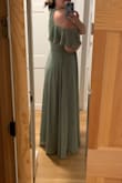 I originally had a different bridesmaid dress for a wedding I'm in that was too formal and didn't look great on my arms. I bought this dress because of the upper arm coverage, and it's so cute! It's a wrap dress, so size wasn't an issue. I'm tall (5'10) and still had to hem about an inch off of it (my shoes have a 1/2" heel). 2 layers of fabric, good quality. I'll probably pin the chest closed because it is a bit revealing when I move around since it's a wrap dress. - Andrea Z.