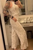 Its a bit larger then it should be. Id say go a size down! It is stunning and i felt like a glass of champagne wearing it. It gets a bit looser as you wear it as well so a XS would have been best for my body only for this particular jumpsuit! Received a lot of compliments on my outfit so it was a hit in my books even if it was a bit large on me. - Sophie M.