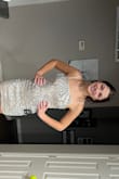 The material is stretchier than I thought but worked well since I ordered a size smaller than I normally would. The pattern and sparkles are beautiful! - Alicia C.