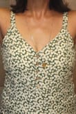 First: perfect fabric, nice fit, just what I wanted - alas the neckline was sewn off center.  Sorry to return this garment. My necklace in this photo is hanging straight down. :( - Elisa N.