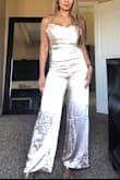 I love this jumpsuit so much I got it in two different colors! Fit true to size got my usual XS. Material is nice and thick. Perfect length for me. I highly recommend this jumpsuit get yourself one already!! I should have steamed this out before I took a picture, comes in very wrinkled. Will definitely steam before I wear it out! - Amy V.