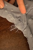 This dress was very cute. It fit well, not particularly tight around the arms or bodice, with enough room to fit comfortably. However, it ripped halfway through the first night I wore it. The rip is not repairable, and I was very disappointed. - Dani G.