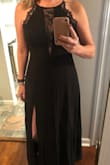 Very pretty, just as pictured. It's slightly roomy but I am between sizes and ordered up. I love the lace detail! Very happy with it for the price! I haven't worn to my event yet, but I think it will be nice for a black tie party. - Tara D.