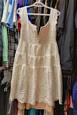 This dress was nice for my bridal shower, but unfortunately I'll never be able to wear it again because if how insanely it shrunk. Extremely disappointed, have never seen anything shrink like this dress did in all my life. That is the attached slip coming out the bottom when the lace is supposed to be much, much longer. - Alyssa J.