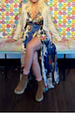 Nice colors and sheen. Very comfortable, sleeves not to long as many dresses are for me. Wore high boots with it, with flats the dress would have been too long. Had to use a safety pin for less dramatic cleavage. - Anja E.