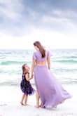 This dress helped me create the most beautiful pictures with my daughter! It is loose on my waist but fits snuggly on top (makes total sense with my body shape), I may get it altered someday but it worked perfectly for our photo shoot and I'm so happy I ordered it! - Danielle L.