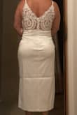 The material is very nice it doesn't have any stretch on the top area it does on the bottom. It is super long for me, I am 4'11 so I will have it alter it. - Isela V.