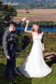 I wore this dress for a mountaintop elopement and it was really simple and lovely. I am 5'8", and it hit the ground perfectly with heels on -- so shorter women may need to consider getting this hemmed. I found the top to be snug compared to the waist / bottom, but not enough that I would size up. For the price, you can't go wrong. - Kristin R.